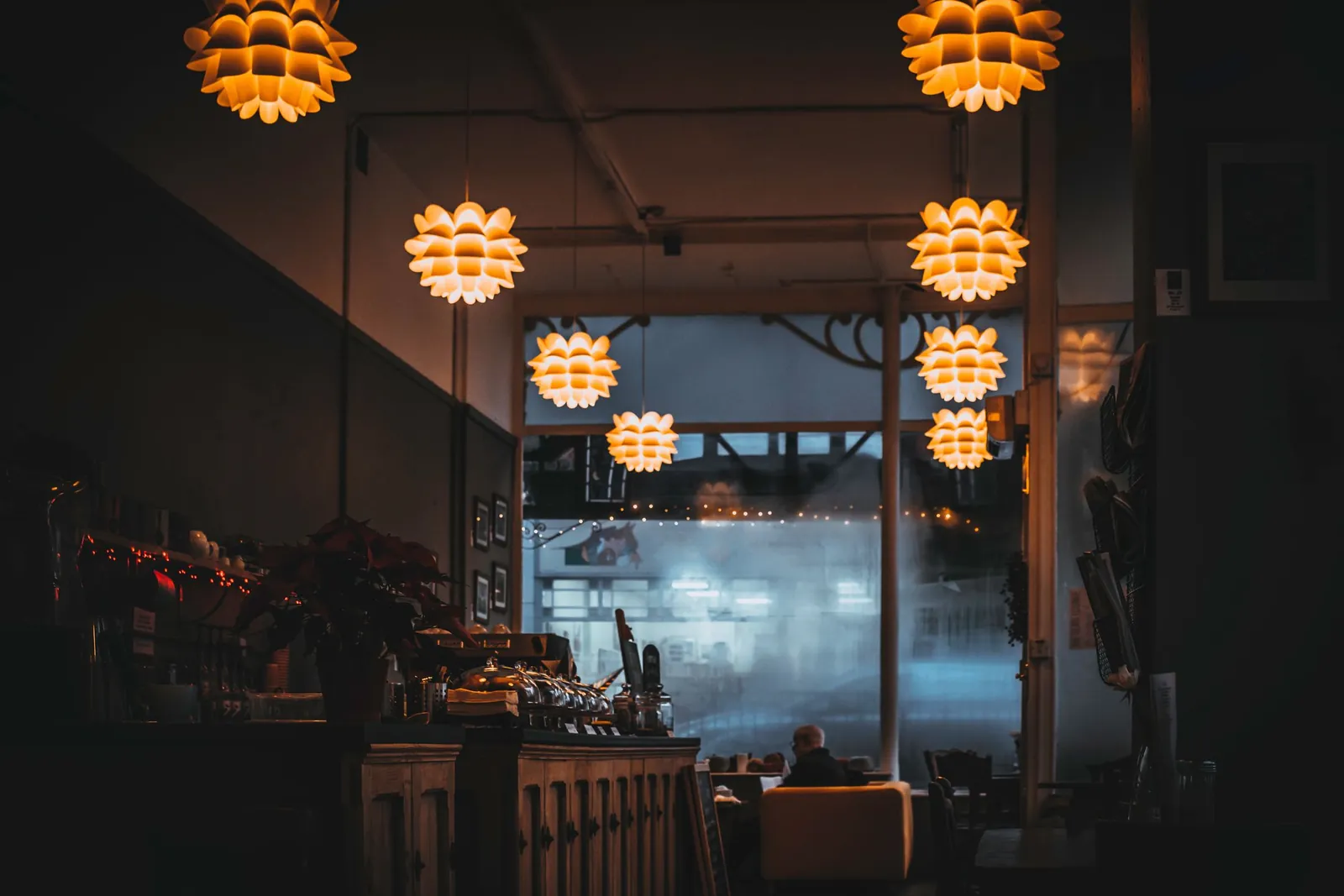 The warm, lamp-lit dining room at Beirut Bodega